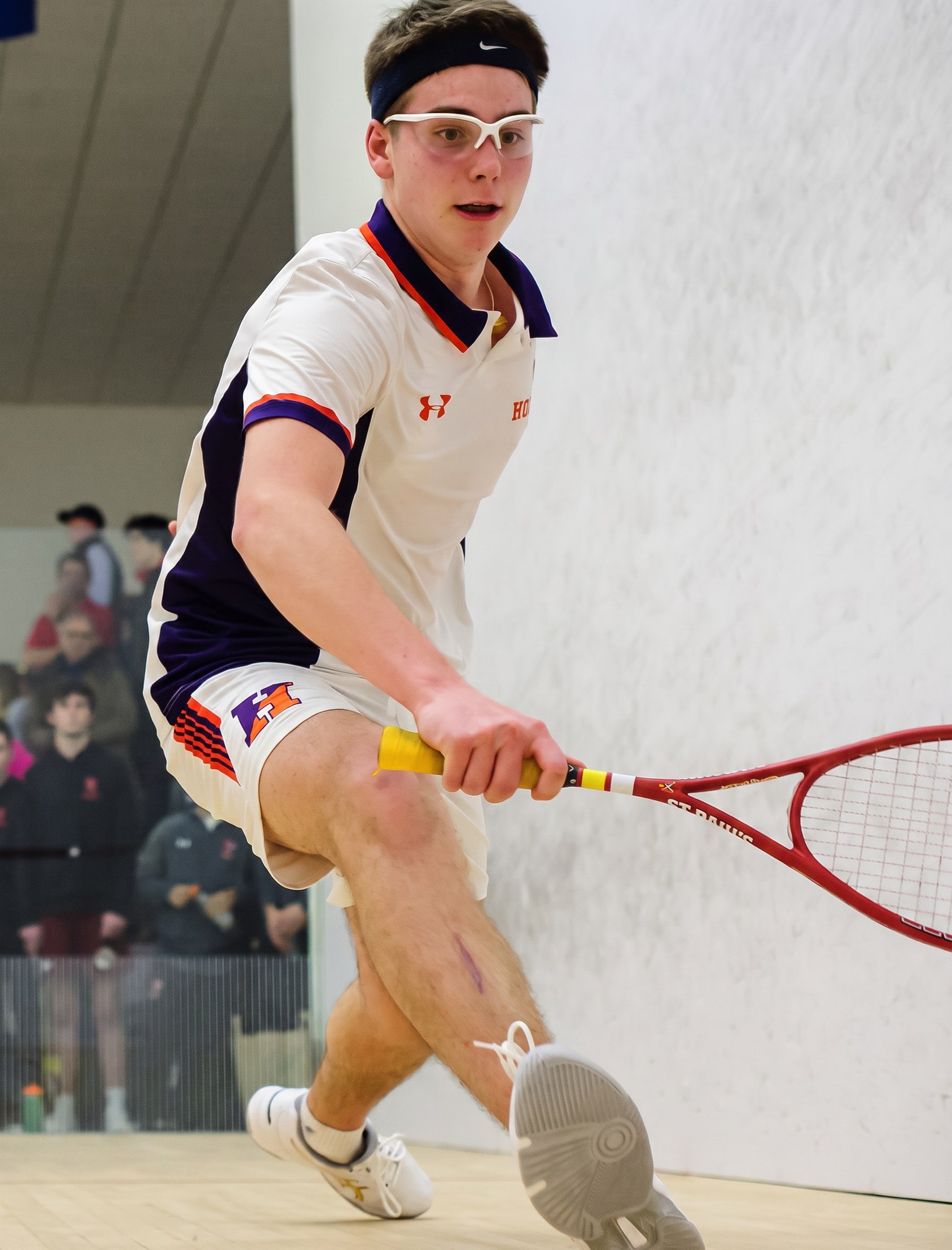 Javier De La Vega on a squash court
