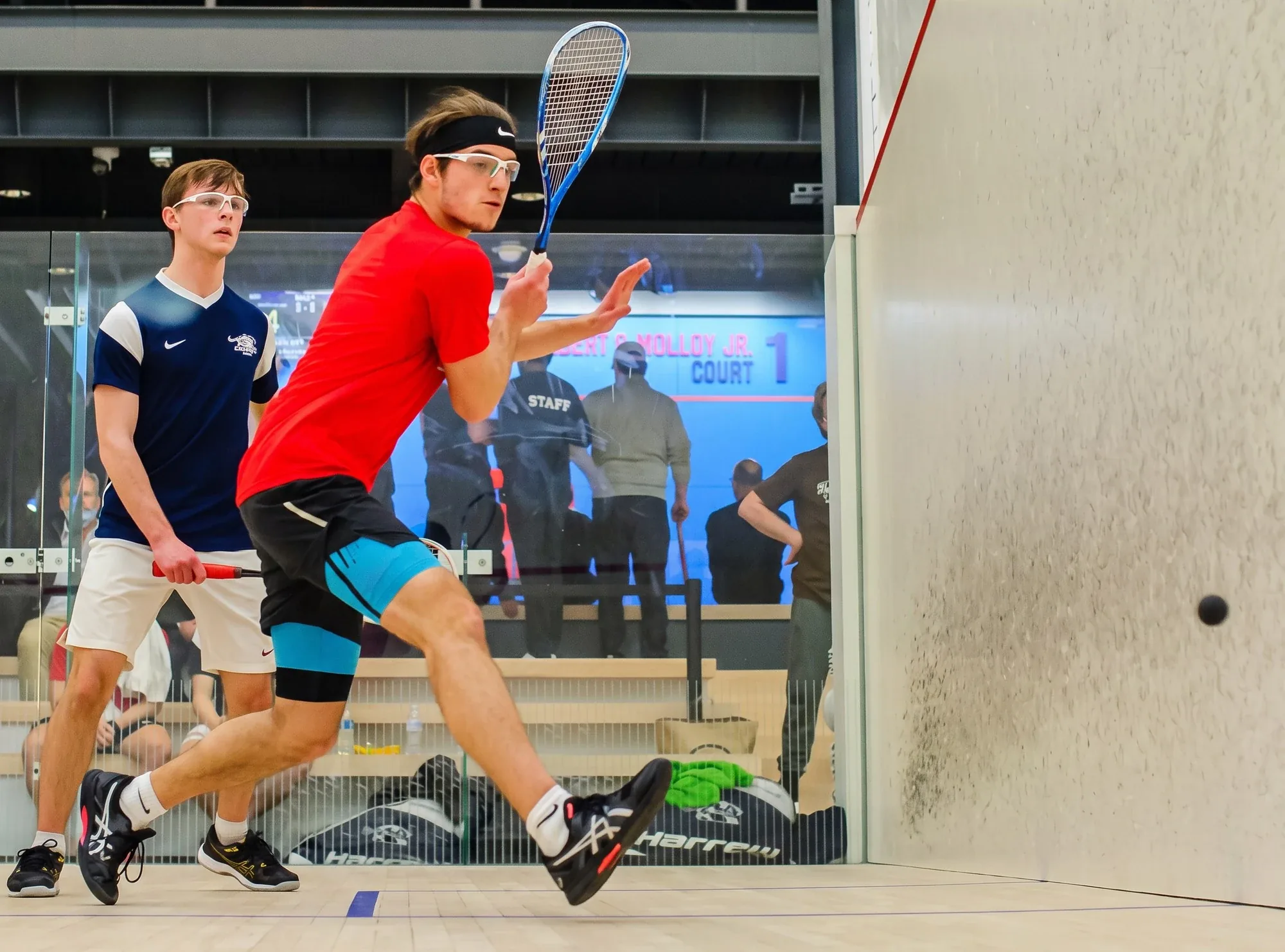 Sebastian De La Vega playing squash
